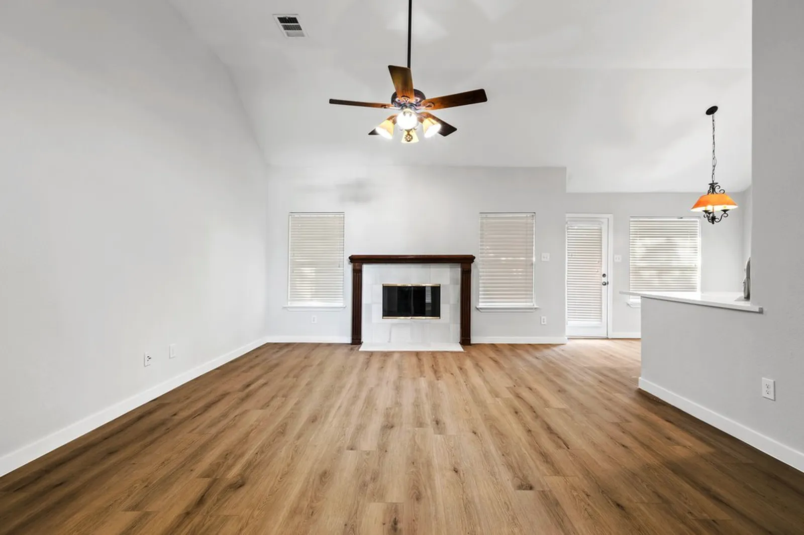 Living room at Biscayne in Frisco after new plank flooring and paint