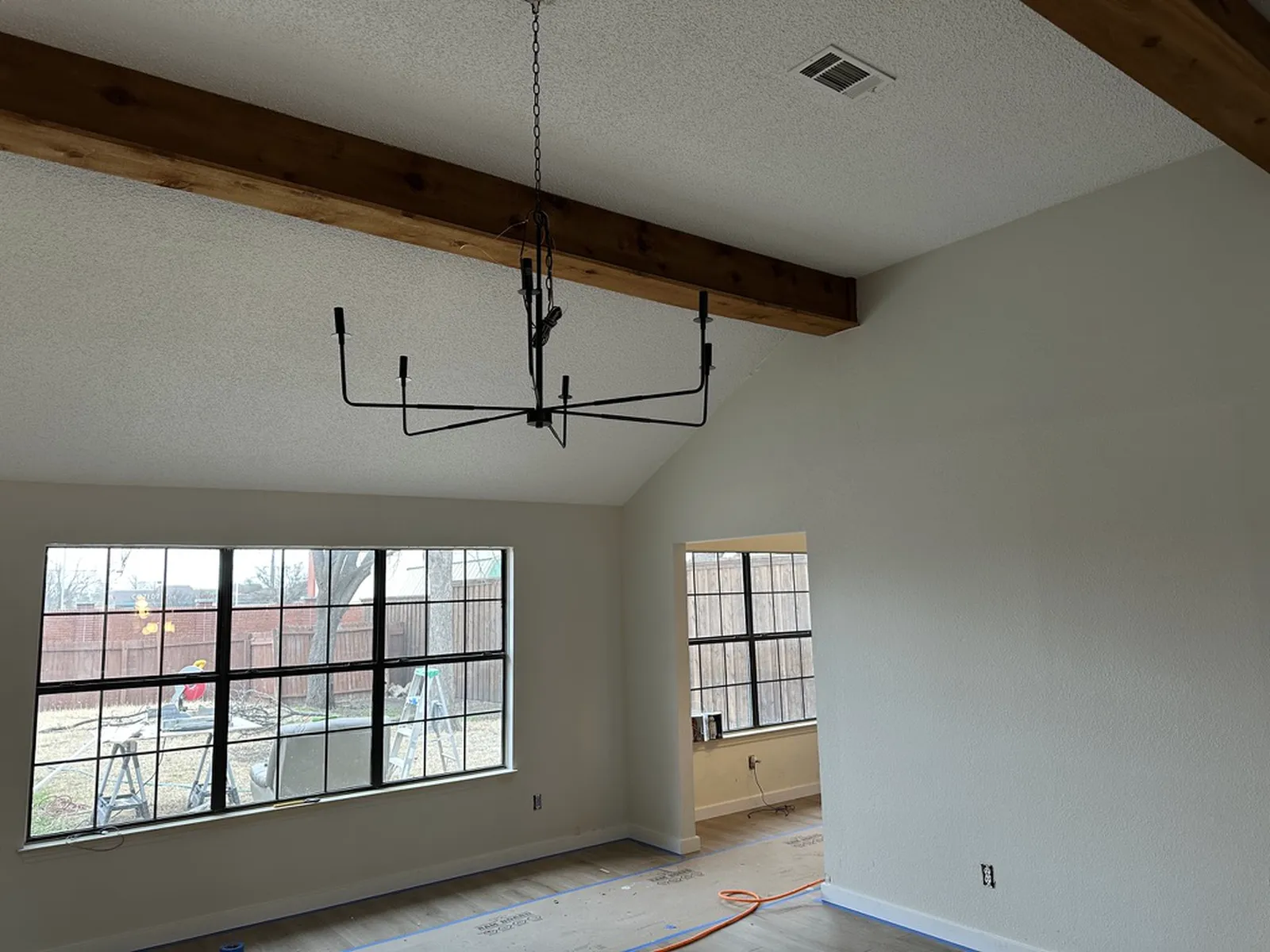 Haven Pl. living and dining area in Allen after paint, flooring, and new lighting