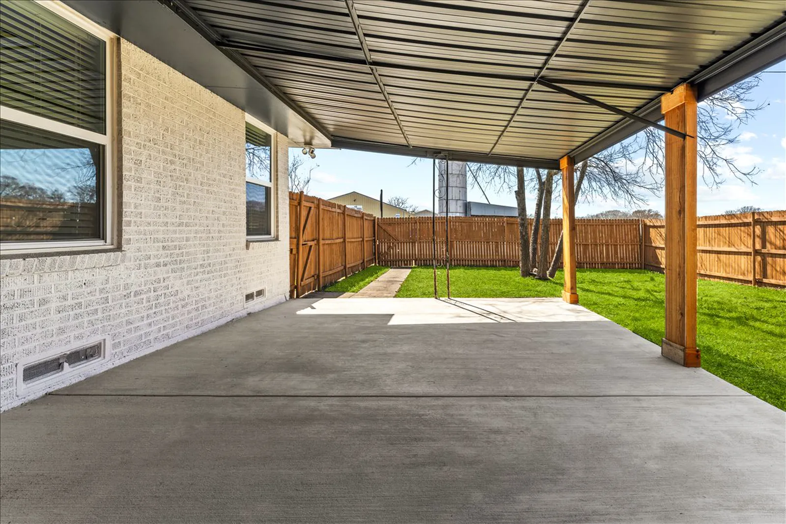 Covered back patio and new lawn at Sherman St. in McKinney