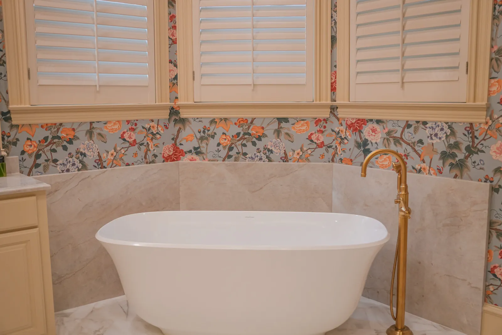 Freestanding tub under plantation shutters at Shubert Ct. in Dallas